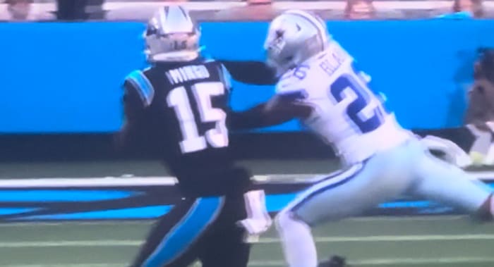 Dallas Cowboys cornerback Daron Bland (right) intercepts Carolina Panthers quarterback Bryce Young's pass.